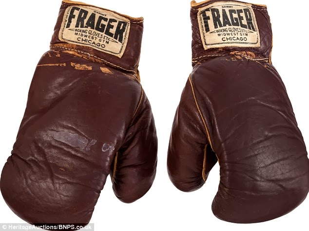 Boxing Gloves go for $836,500.